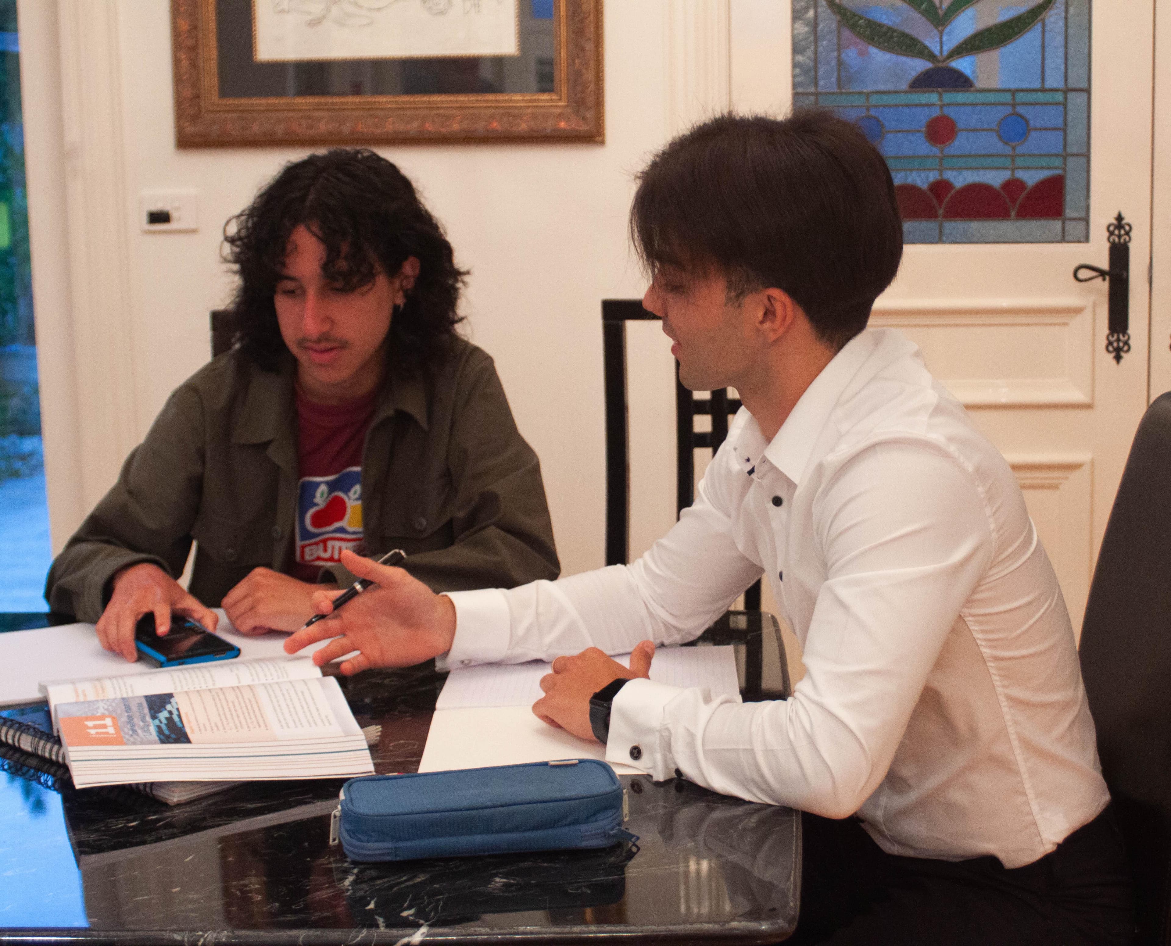 Tutor teaching student